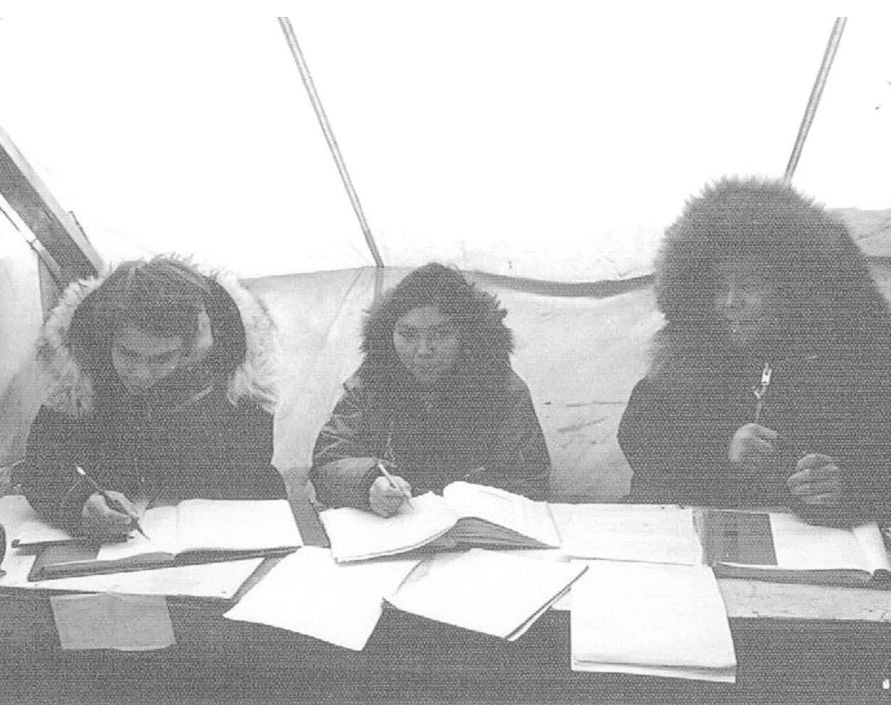 Historical photo of people signing permitts